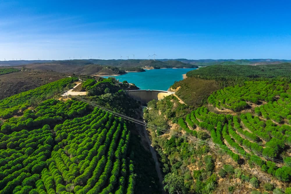 The turquoise Barragem da Bravura reservoir and dam, beside Moinhos Velhos